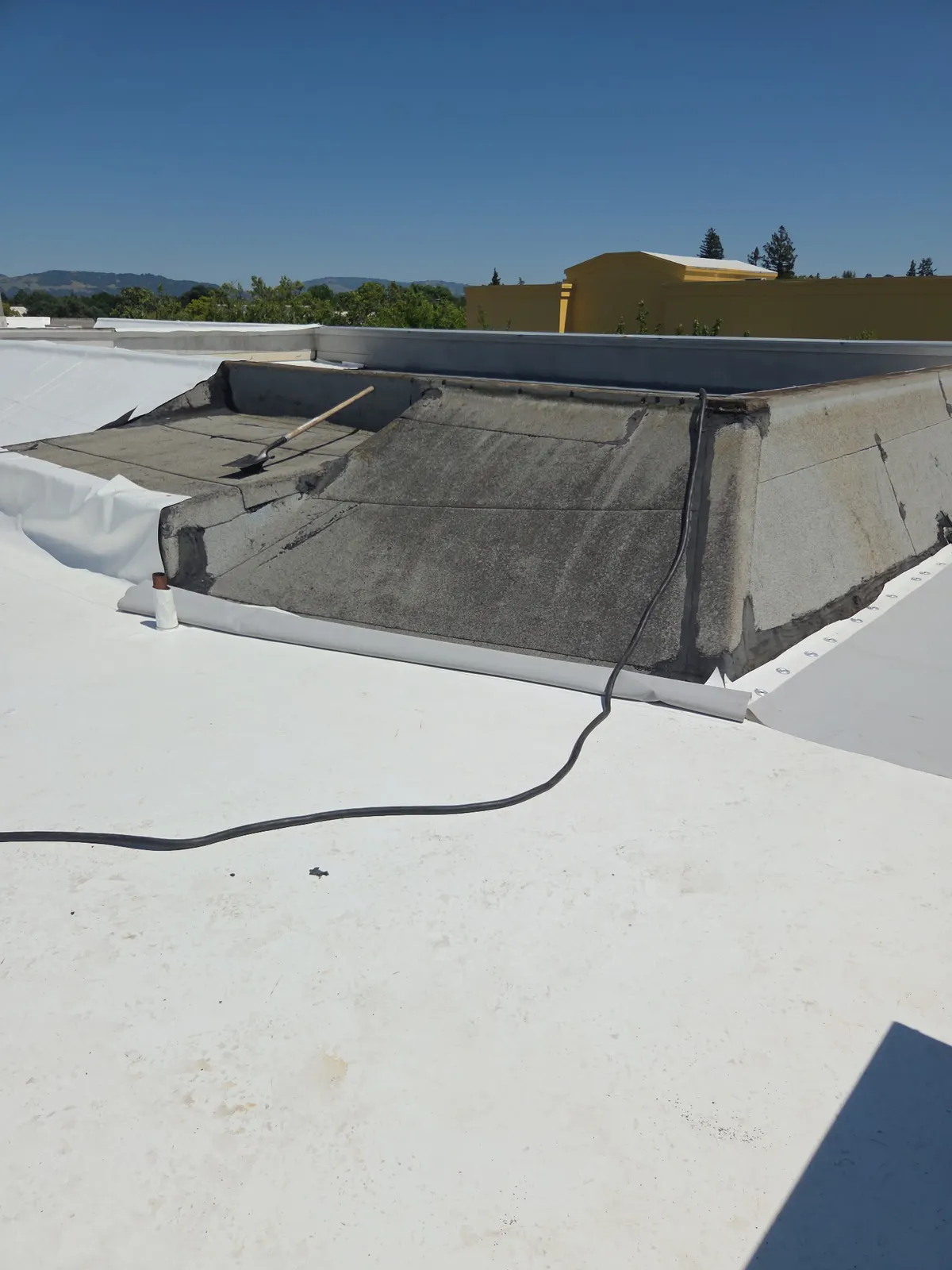 Flat TPO roof with skylight curb flashing detail in Santa Rosa