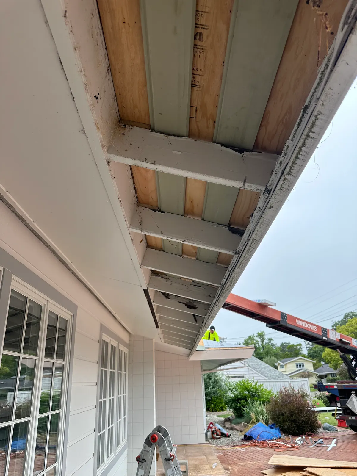Open eave and soffit framing repair during roof replacement
