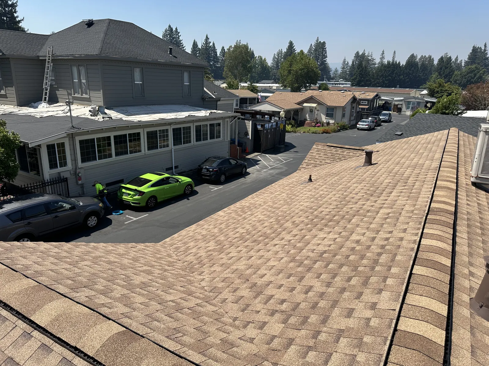 Wide view of a completed shingle roof over a Healdsburg manufactured-home community