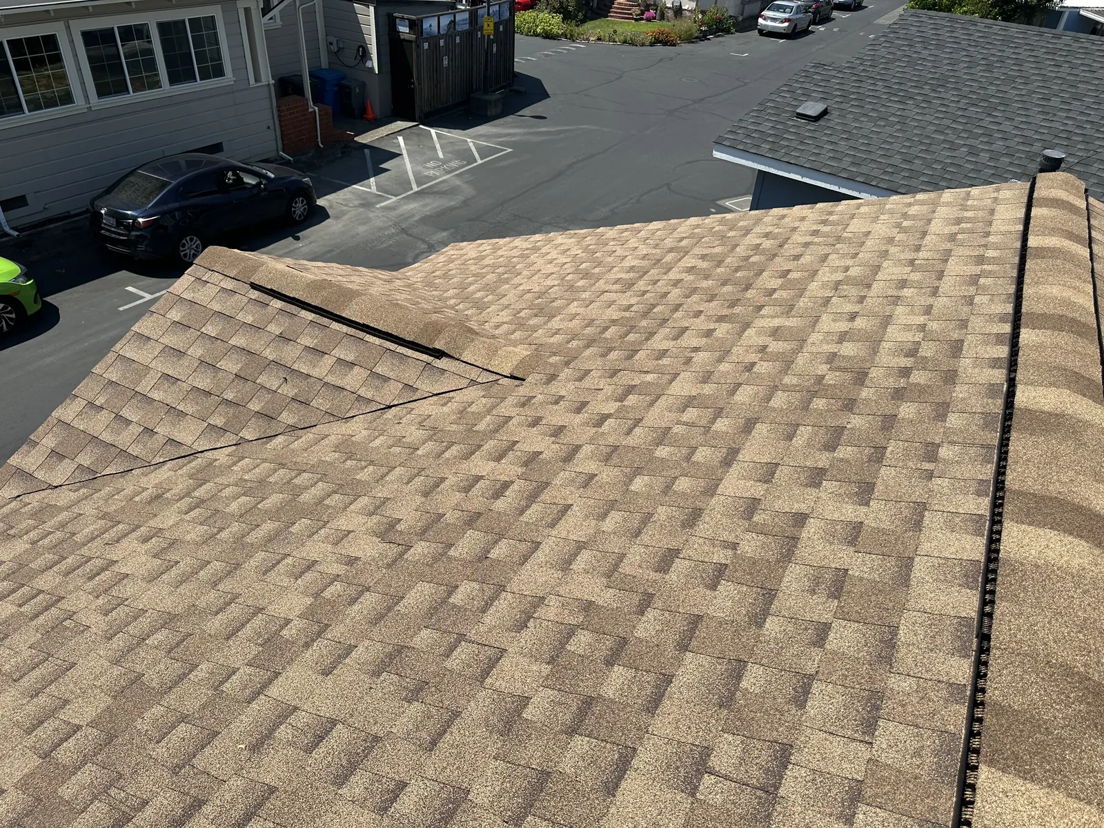 Completed tan shingle roof with hip and ridge detail on a Healdsburg manufactured home