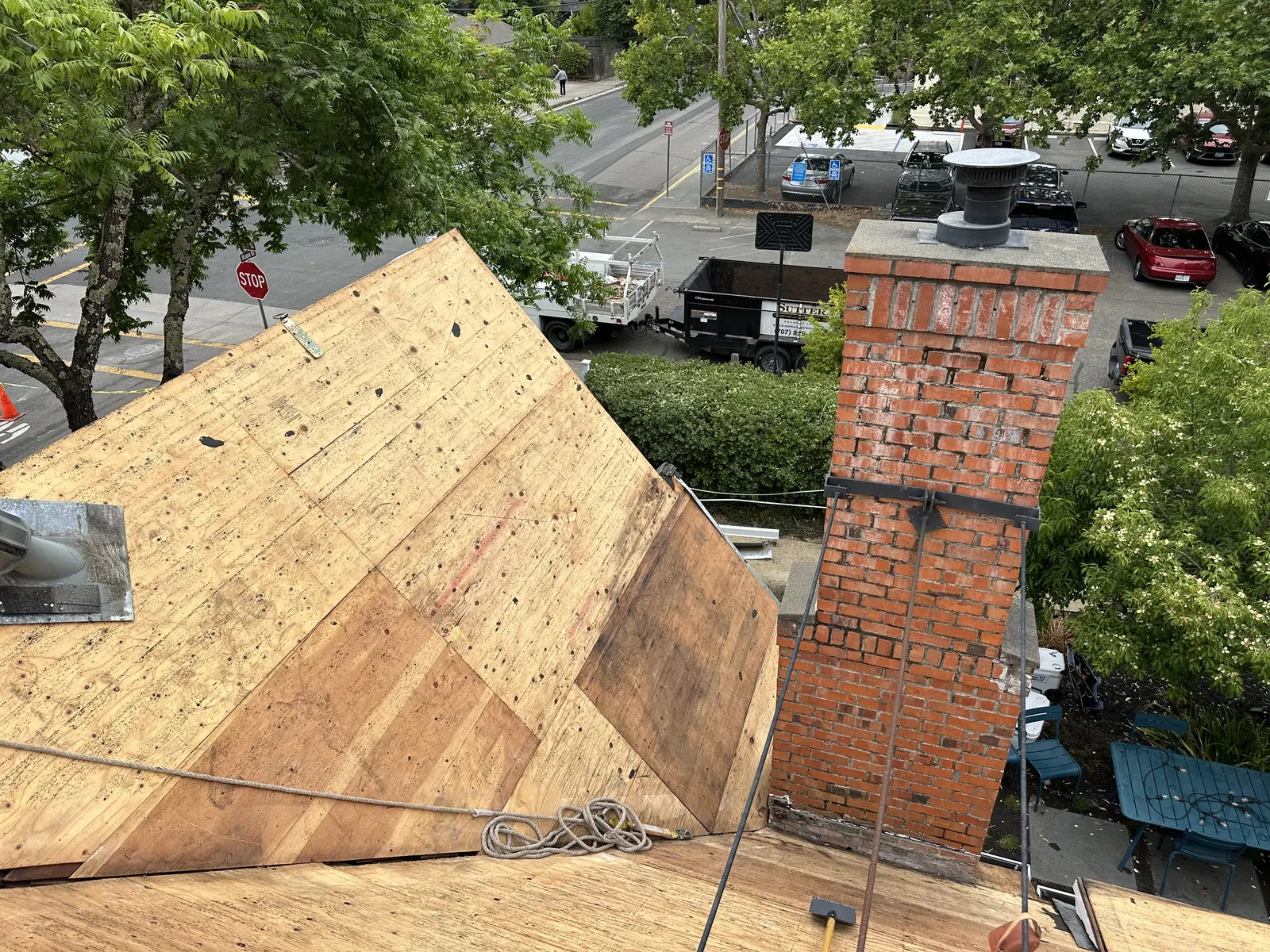 New roof decking beside a brick chimney over downtown Healdsburg