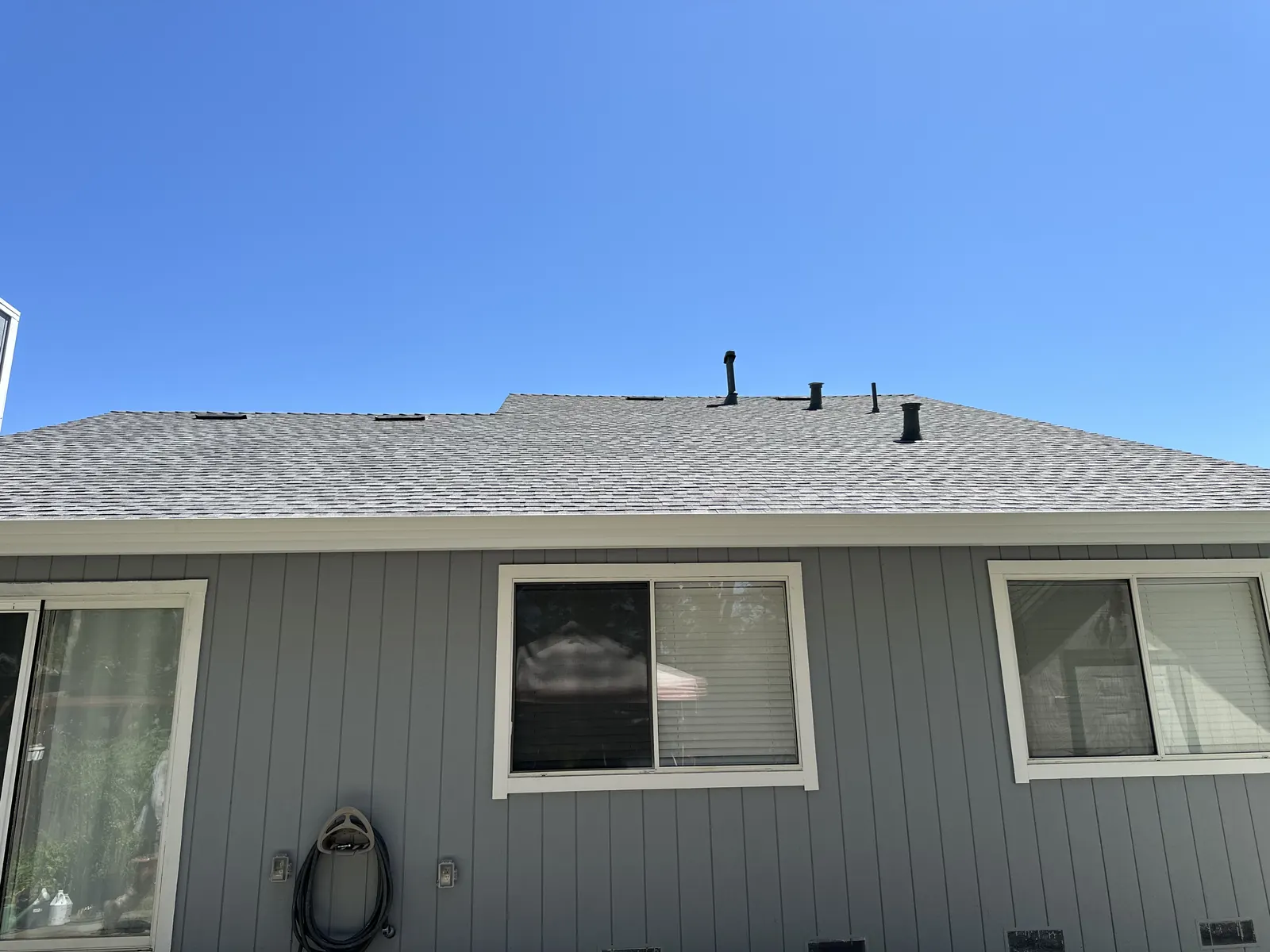 Completed shingle roof and roof vents along the rear elevation of a Rohnert Park home