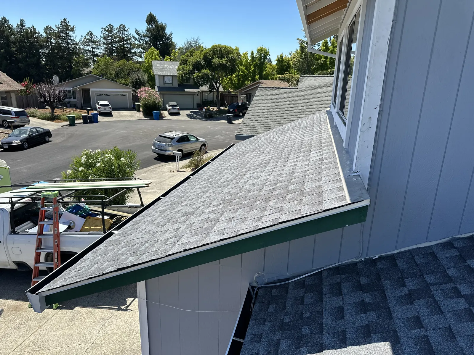 New shingles and drip edge on a low-slope porch roof during a Rohnert Park re-roof