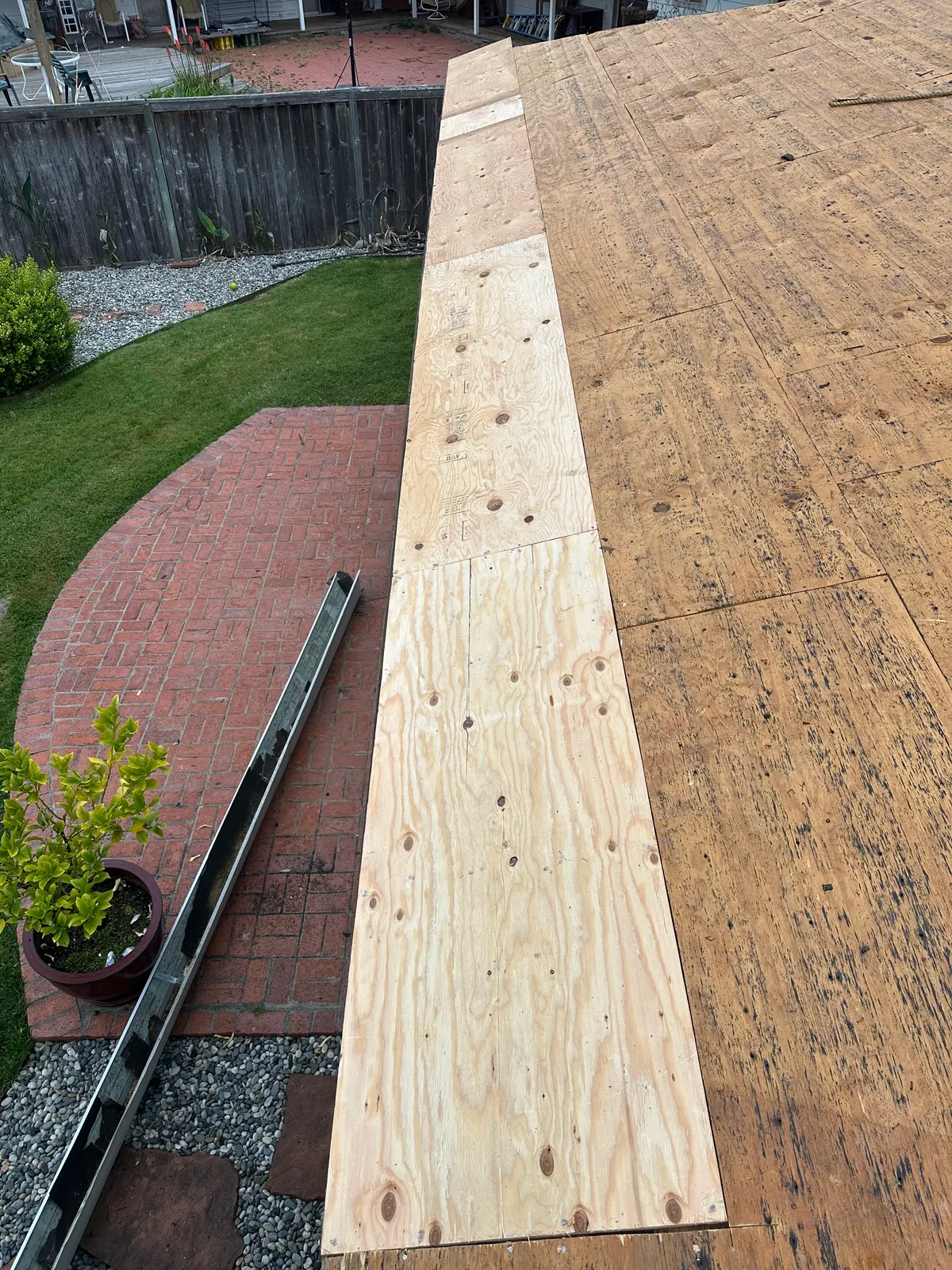 Long run of new plywood deck installed during roof replacement